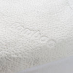 Close-up of a bamboo waterproof mattress protector with the word "bamboo" woven into the fabric.