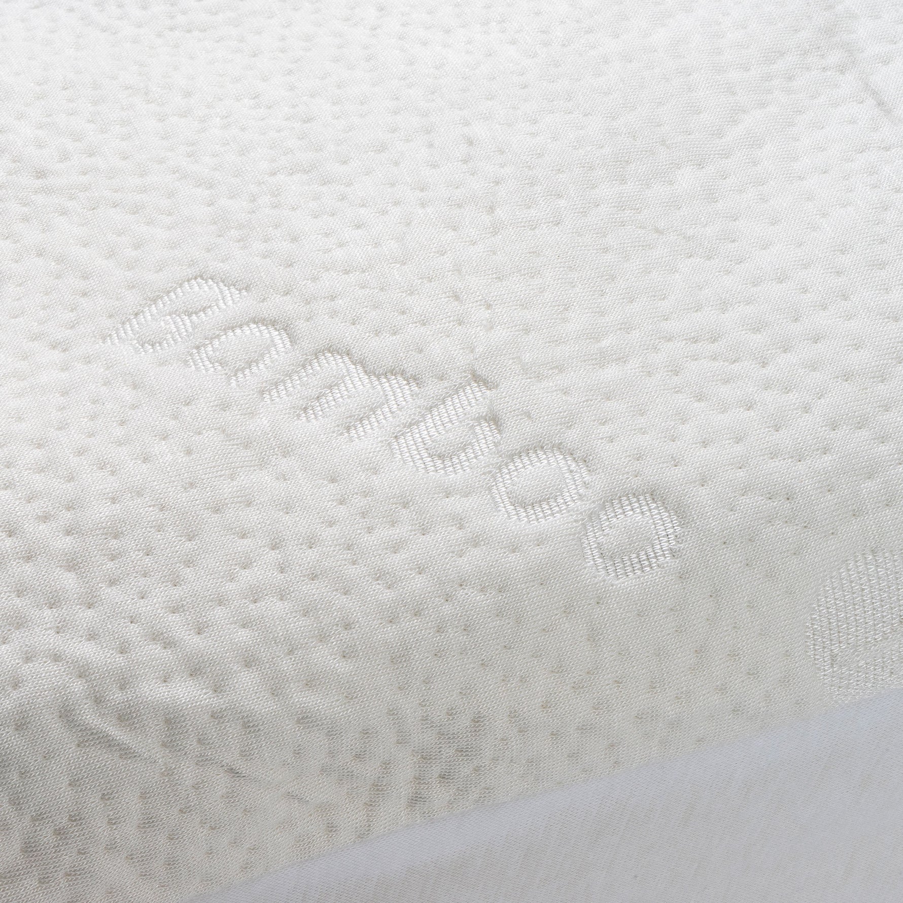 Close-up of a bamboo waterproof mattress protector with the word "bamboo" woven into the fabric.