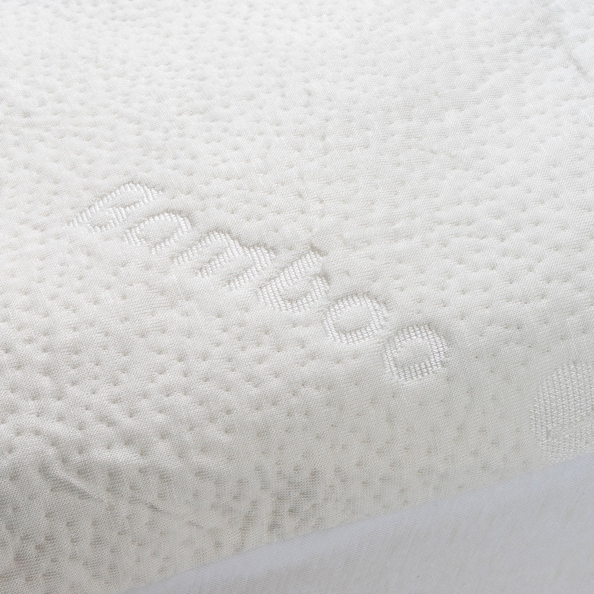 Close-up of a bamboo waterproof mattress protector with the word "bamboo" woven into the fabric.