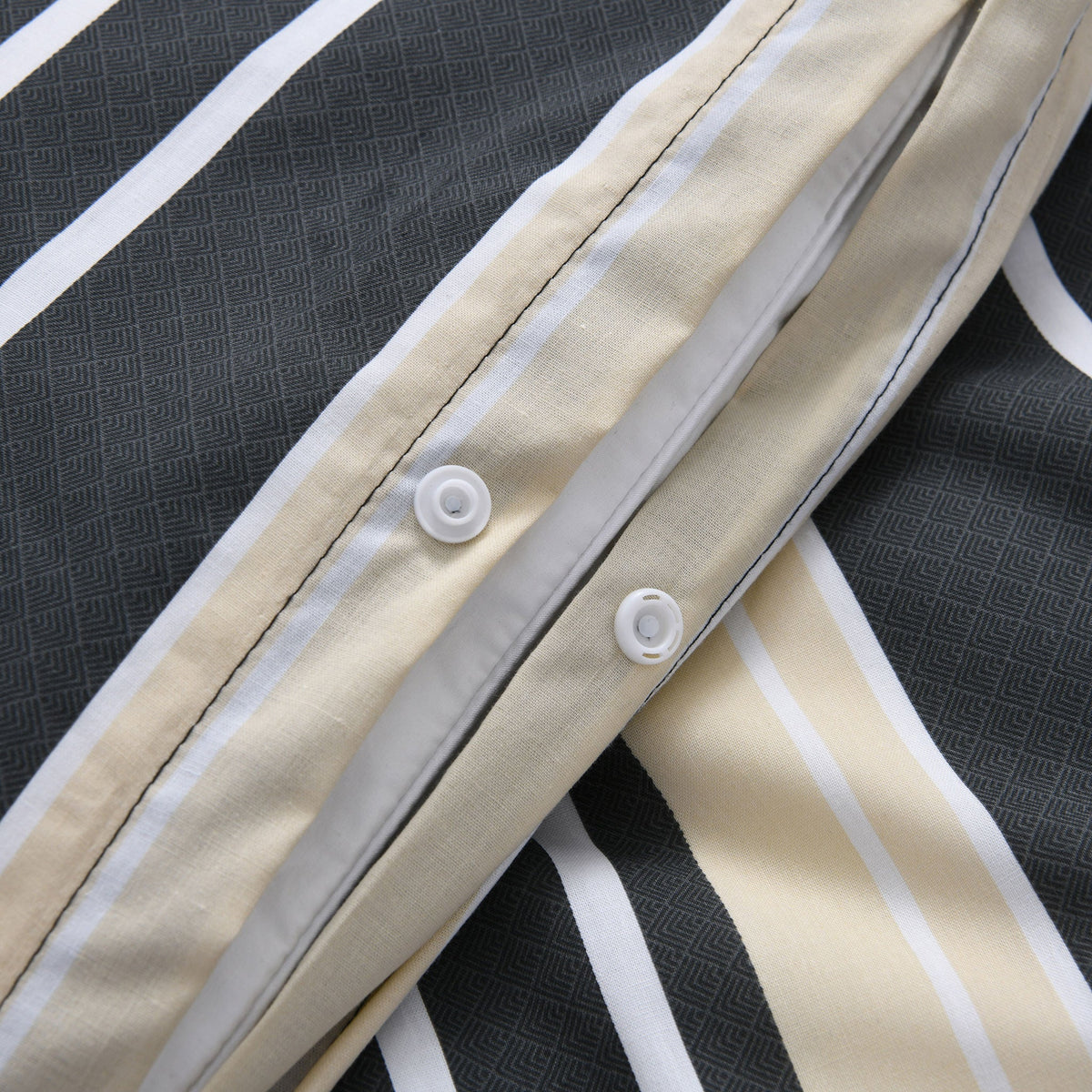 Close up of snap button closure on Brighton Stripe quilt cover
