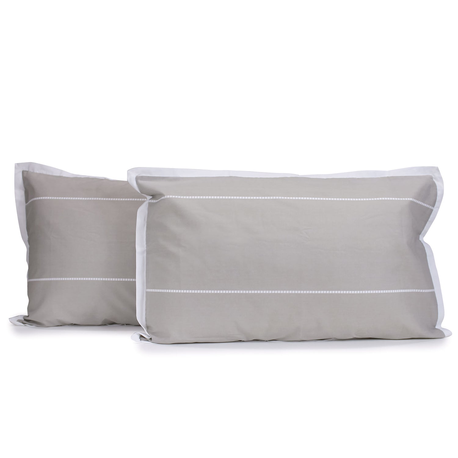 Pair of hazel beige and white Calista pillowcases with white horizontal dashed stripes and white tailored edges, fitted over pillows on a white background.