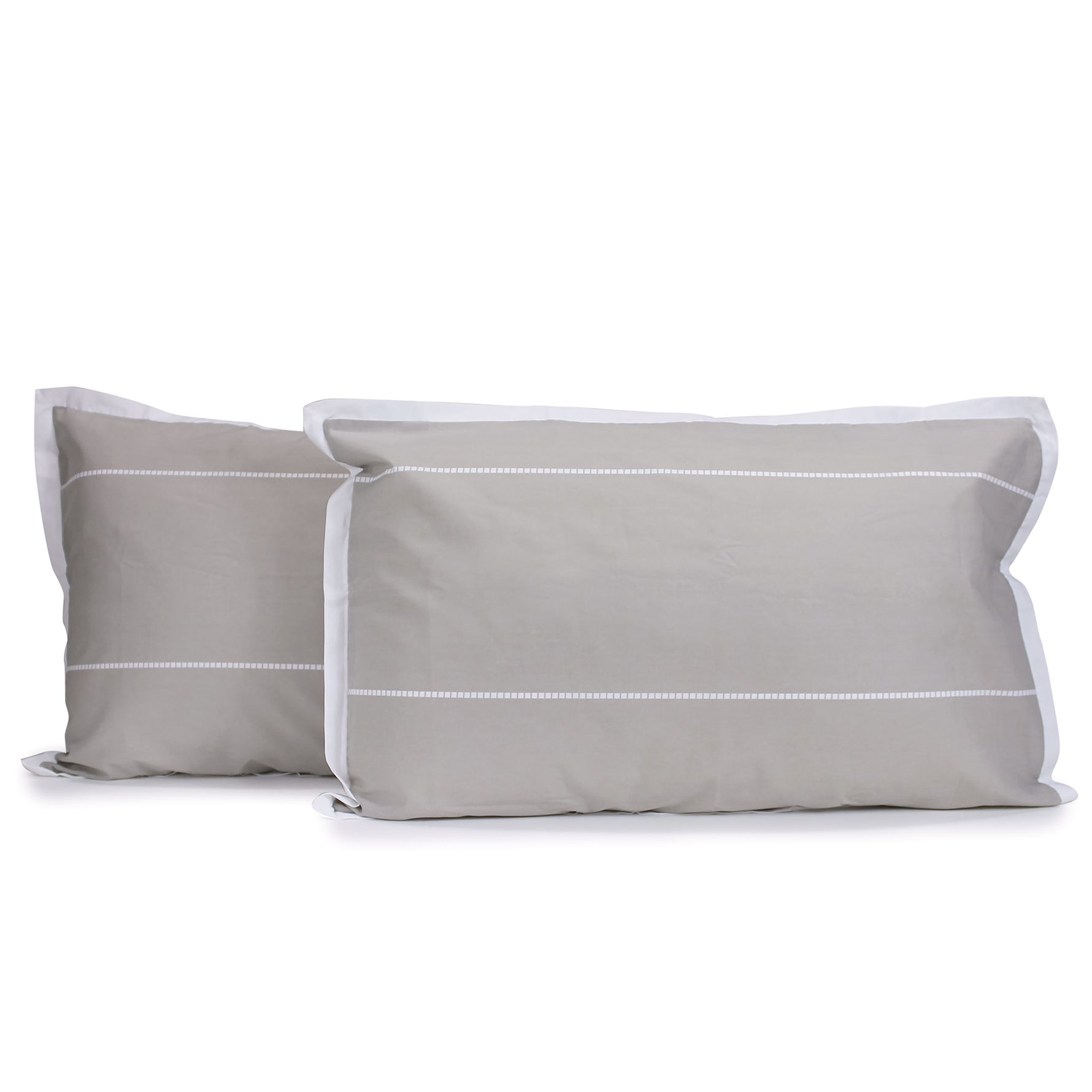 Pair of hazel beige and white Calista pillowcases with white horizontal dashed stripes and white tailored edges, fitted over pillows on a white background.