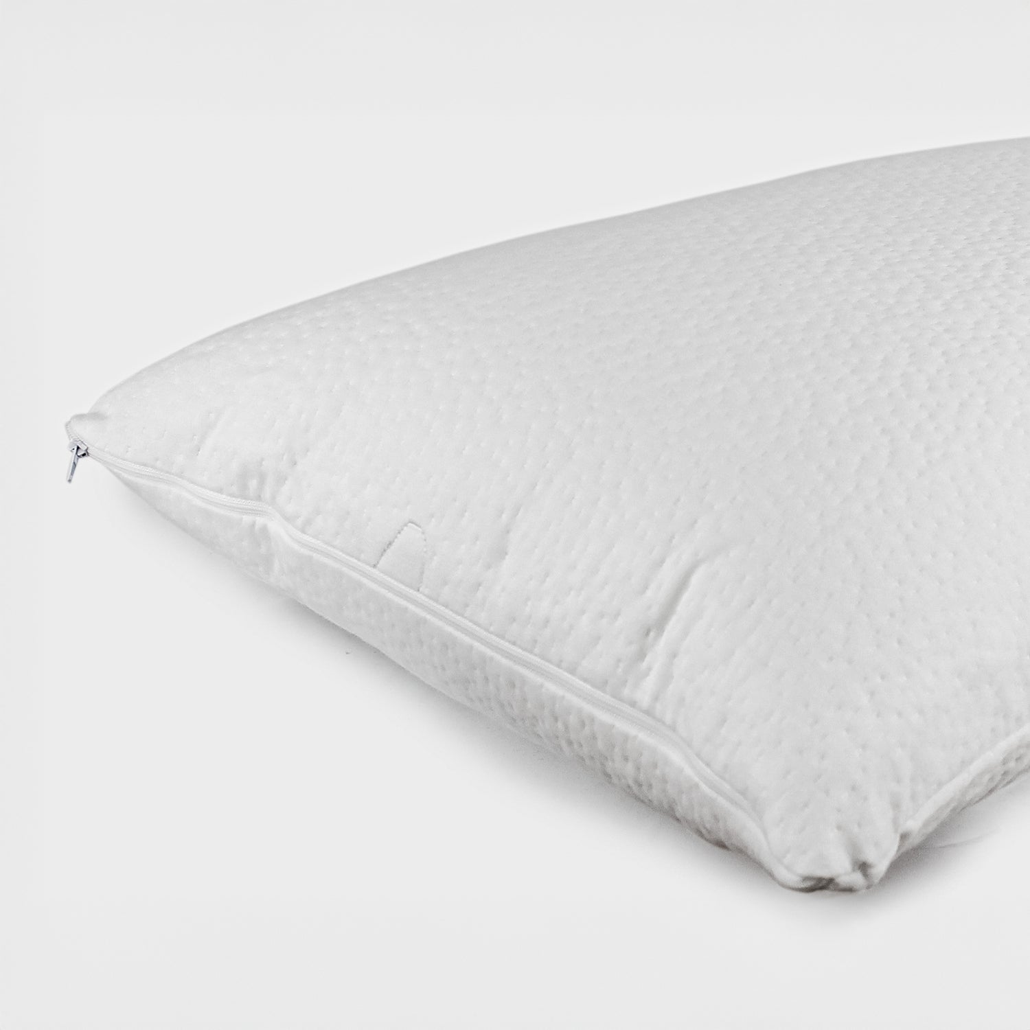 White CoolMax waterproof pillow protector with zip closure fitted over a pillow on a white background.