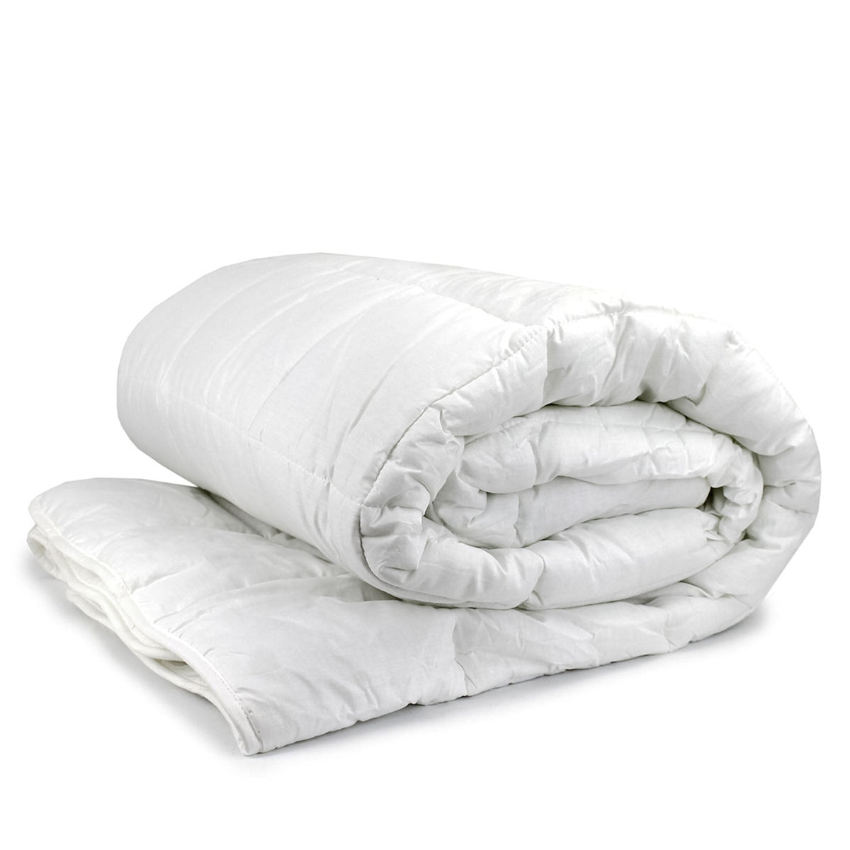 Heavenly Dreams quilt for hotels styled on a made bed