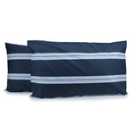 Pair of Hudson Stripe pillowcases in Navy with horizontal light blue and white printed stripes, fitted over pillows on a white background.