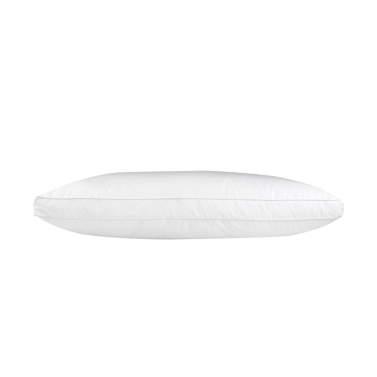 White J-Dream Plush gusseted pillow with a cotton Japara cover and piped edging, shown in side profile on a white background.