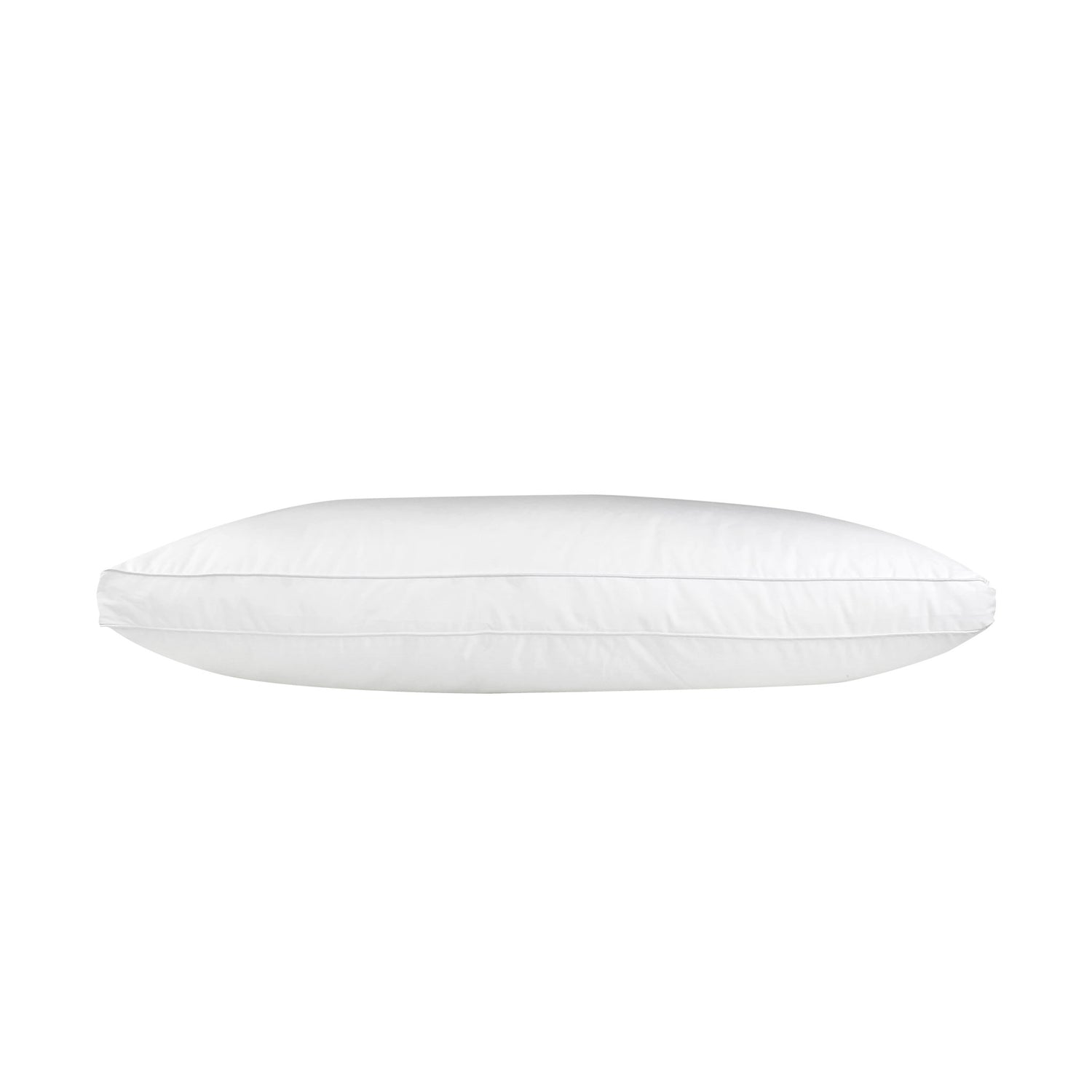 White J-Dream Plush gusseted pillow with a cotton Japara cover and piped edging, shown in side profile on a white background.