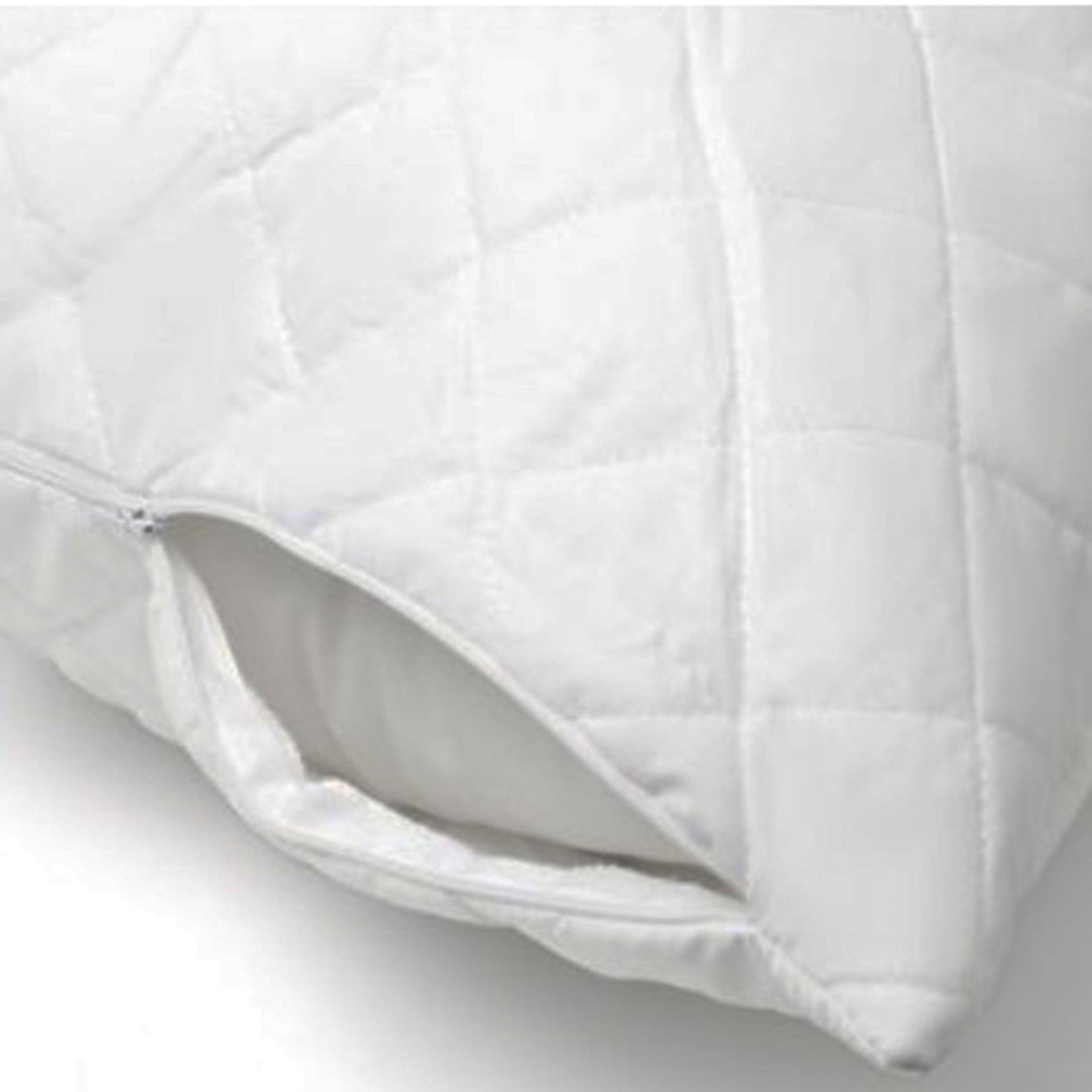 Close-up of a white J-Dream quilted pillow protector with a zipper partially opened, showing a pillow inside.