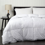 Luxurious white quilt with 70% duck down and 30% feather filling, styled on a neatly made bed.