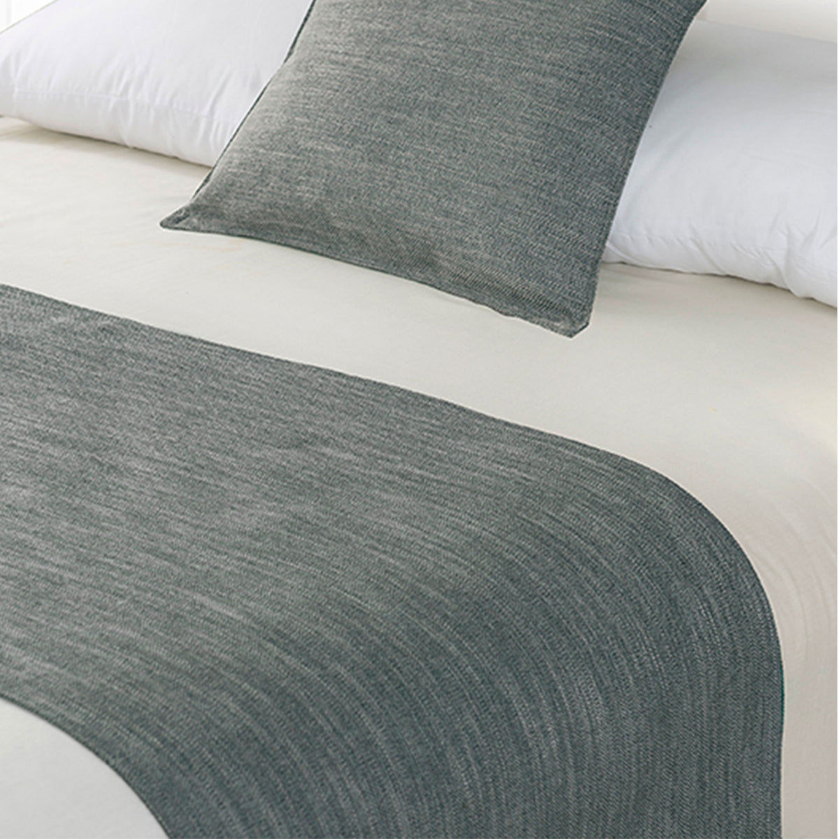 Pewter grey linen-look bed runner and matching cushion displayed on a bed with white bedding.