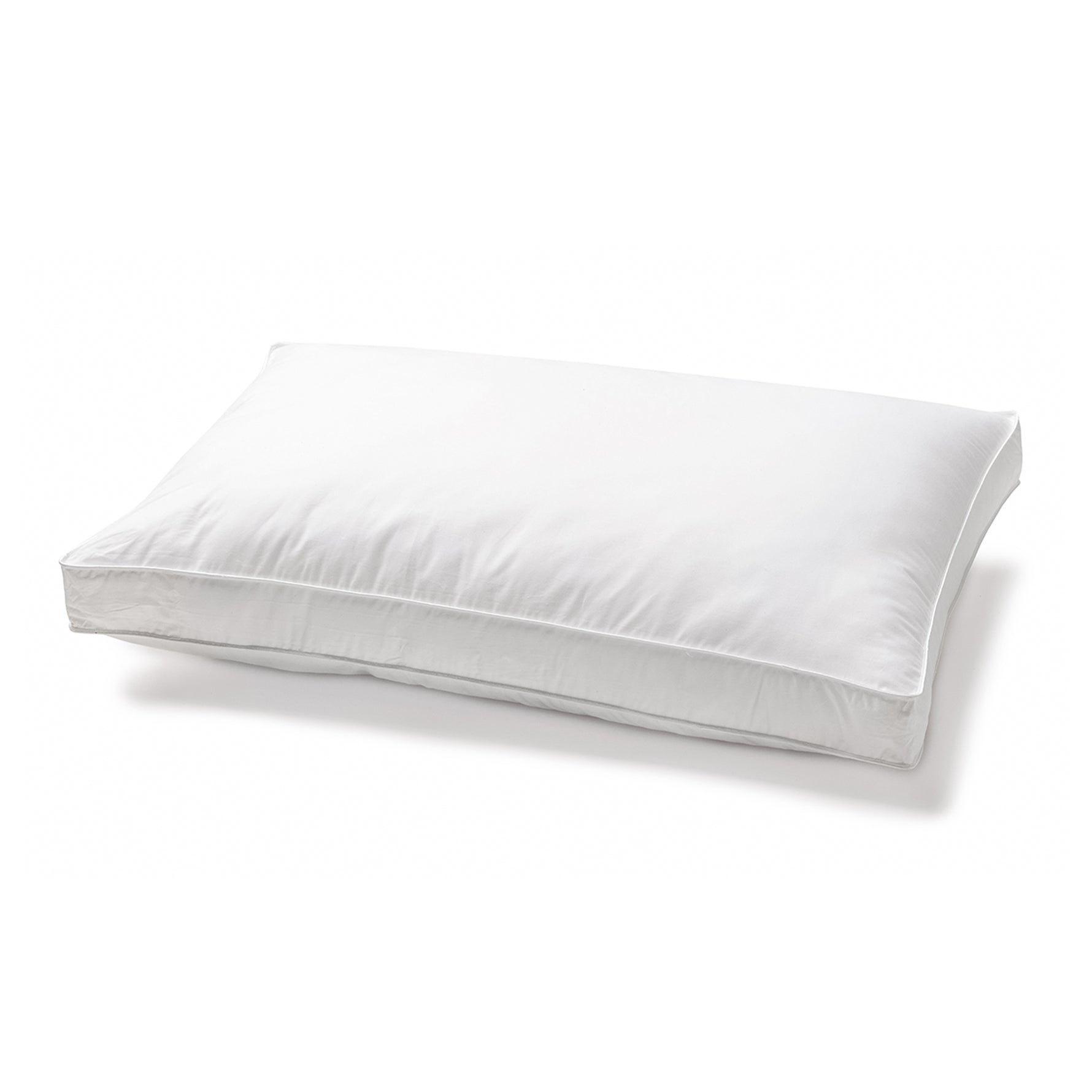White gusseted microfibre pillow with a cotton Japara cover and piped edging on a white background.