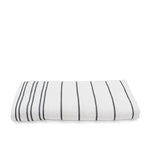 Folded white terry pool towel with steel grey horizontal pinstripes on a white background.