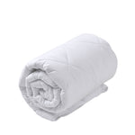 Rolled white diamond-quilted Repreve all-seasons quilt shown in a three-quarter view on a white background.