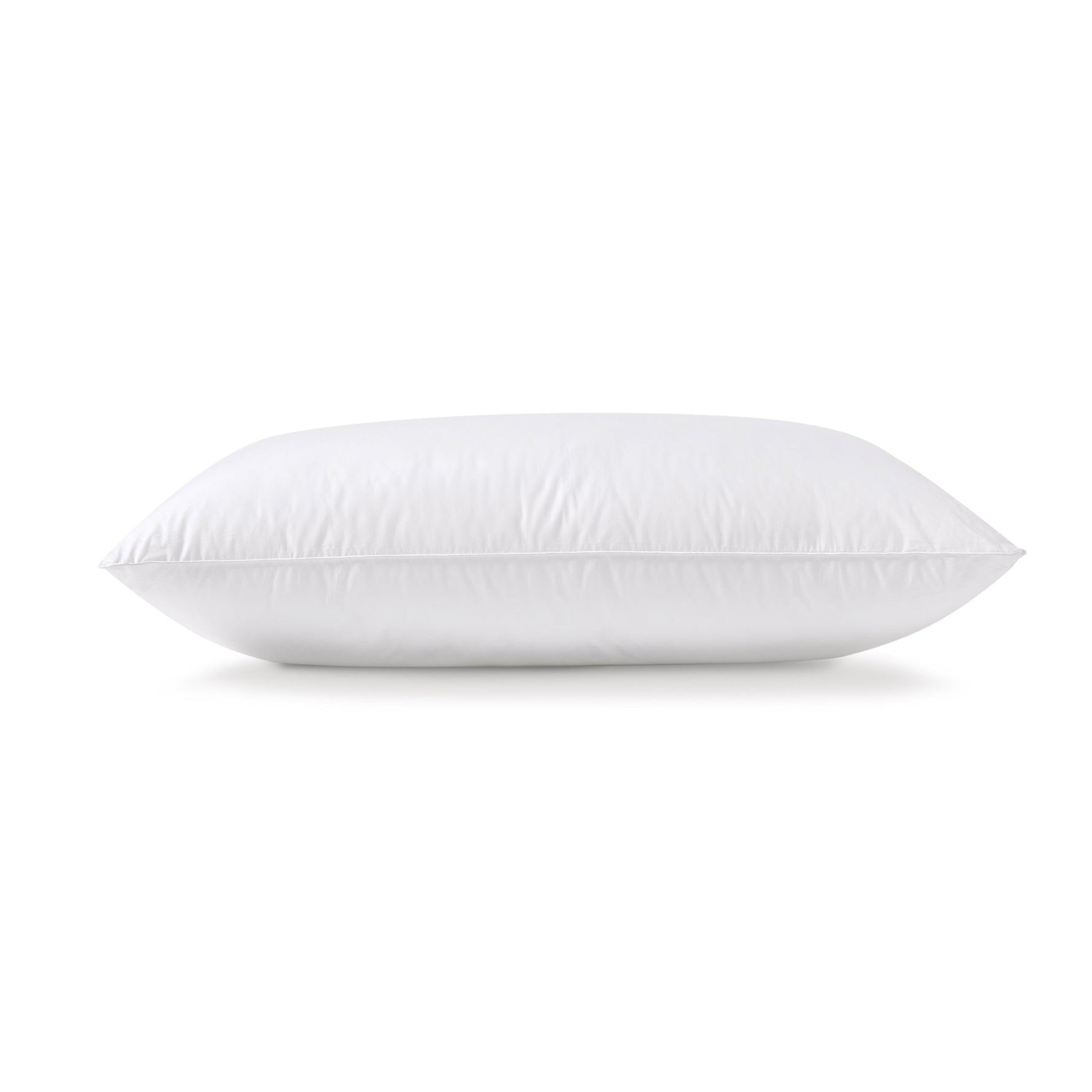 White Repreve pillow with piped edging shown in side profile on a white background.