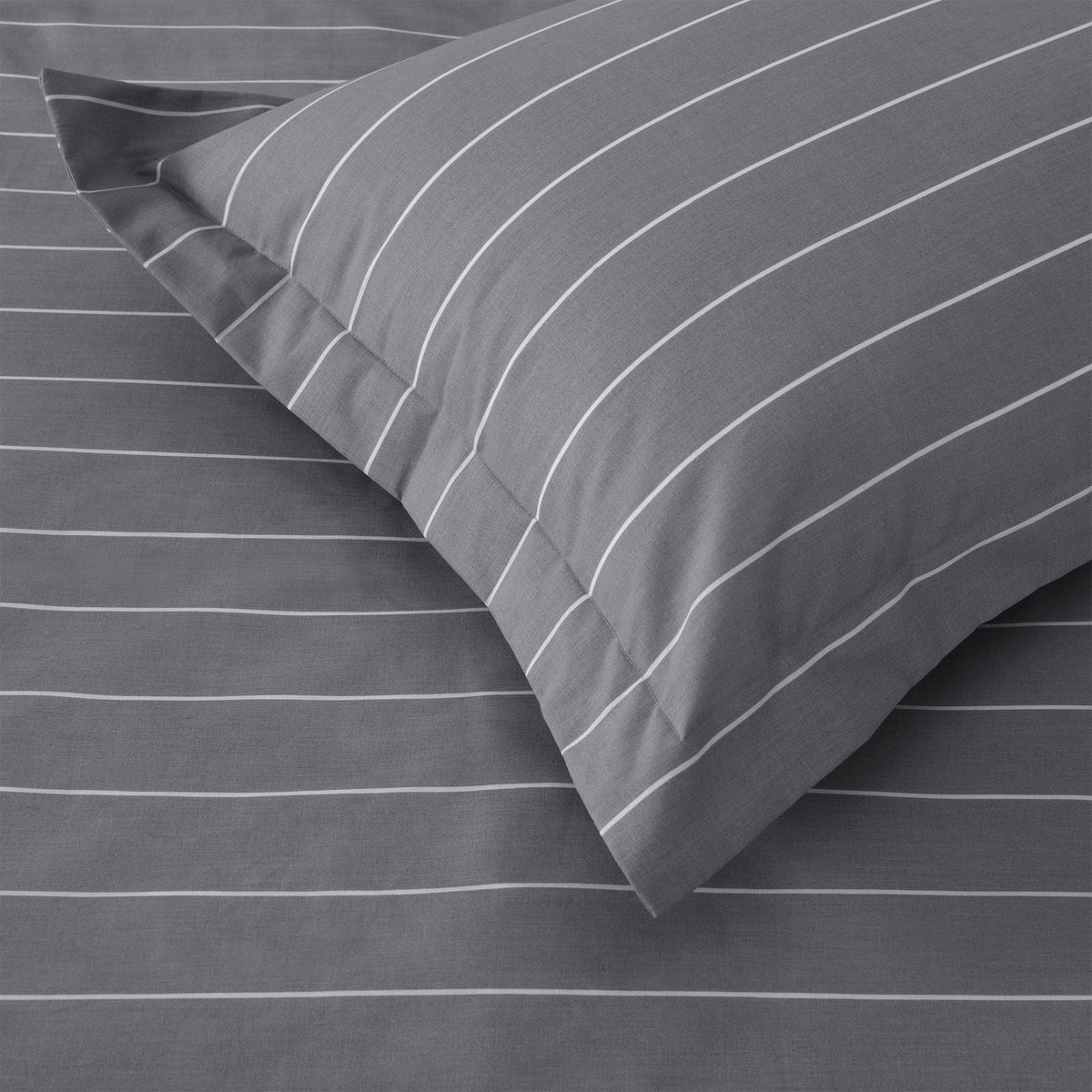 Close up of Studio Stripe pillowcase corner in slate grey