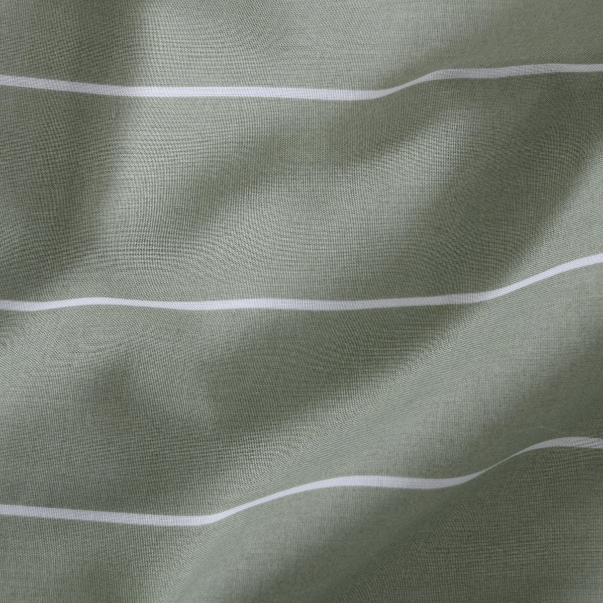 Close up of Studio Stripe fabric print in sage green