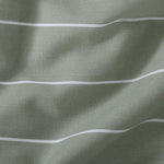 Close up of Studio Stripe fabric print in sage green